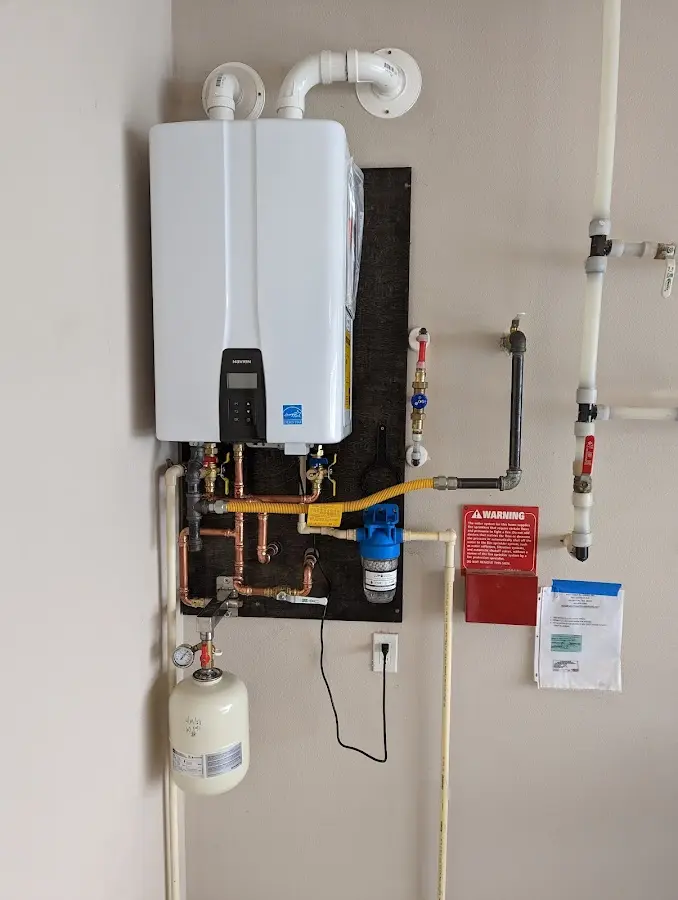 Professional plumber installing copper piping in a South Miami Heights home